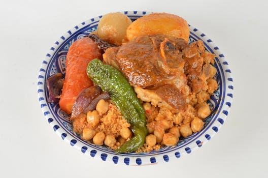 A vibrant plate of Moroccan couscous featuring tender lamb, vegetables, and chickpeas.