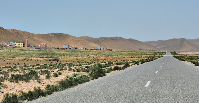 Captivating landscape view of Irherm village, mountains, and road in Souss-Massa, Morocco.
