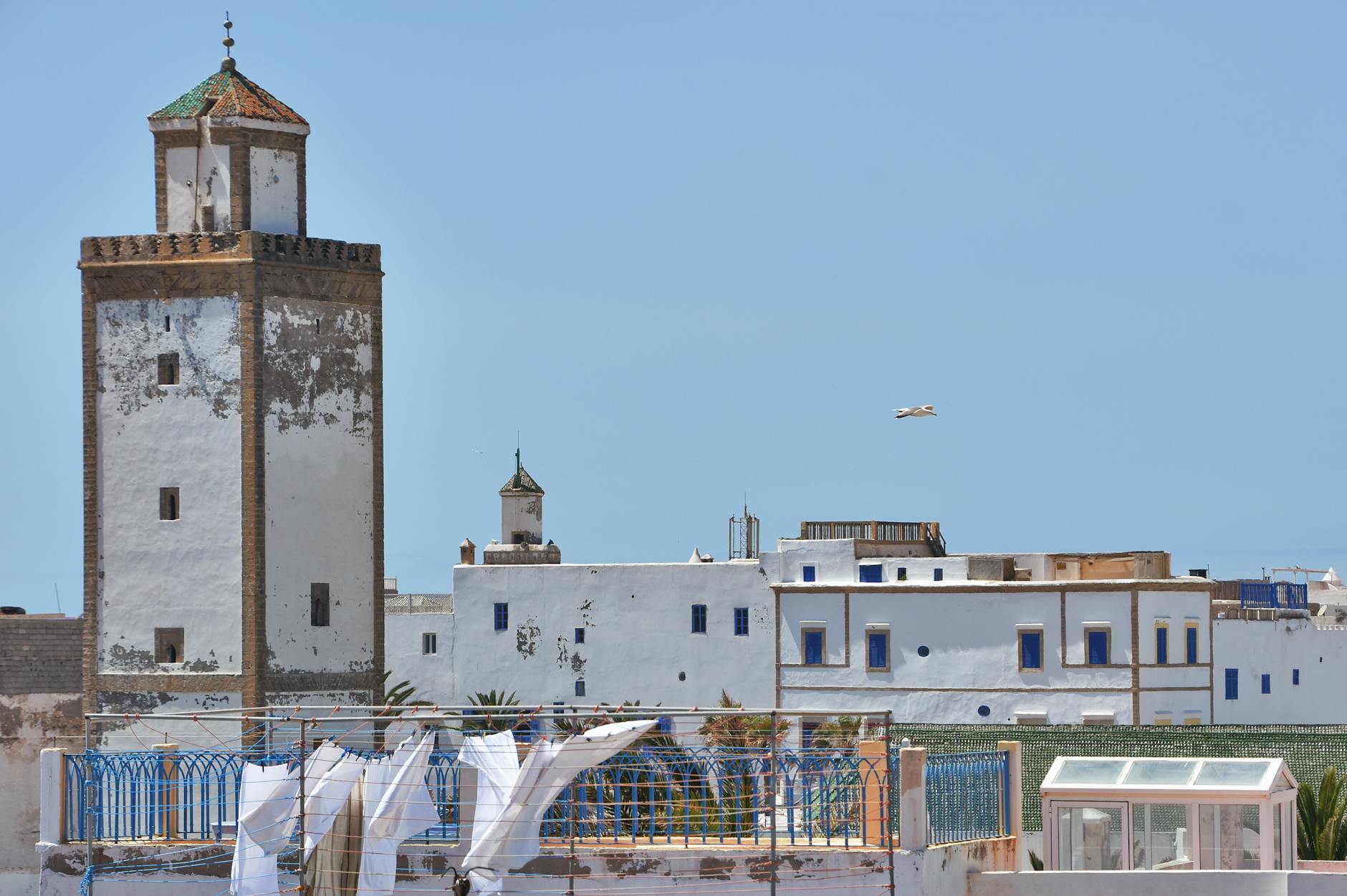 Scenic view of historic architecture and coastal fortress walls in Essaouira, Morocco.