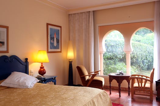 Inviting hotel room in Rabat, Morocco with elegant furnishings and a view.
