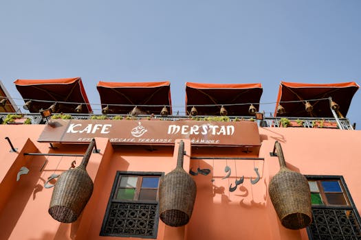 Discover the vibrant architecture of Kafe Merstan, a rooftop café in historic Marrakech.